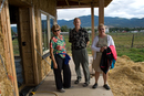 Merry , Bob, & Sue in front of the straw bail house